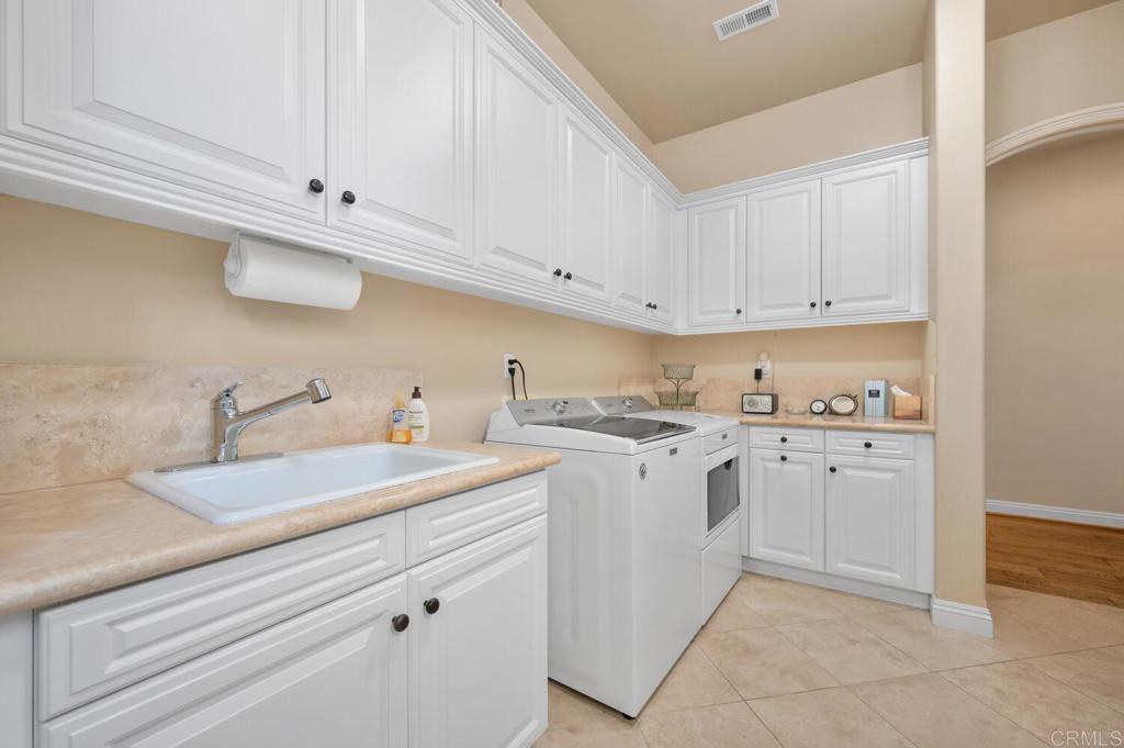7089 Heron Circle Carlsbad, CA 92011 - Photo 35 of 58 a view of a kitchen sink and dishwasher