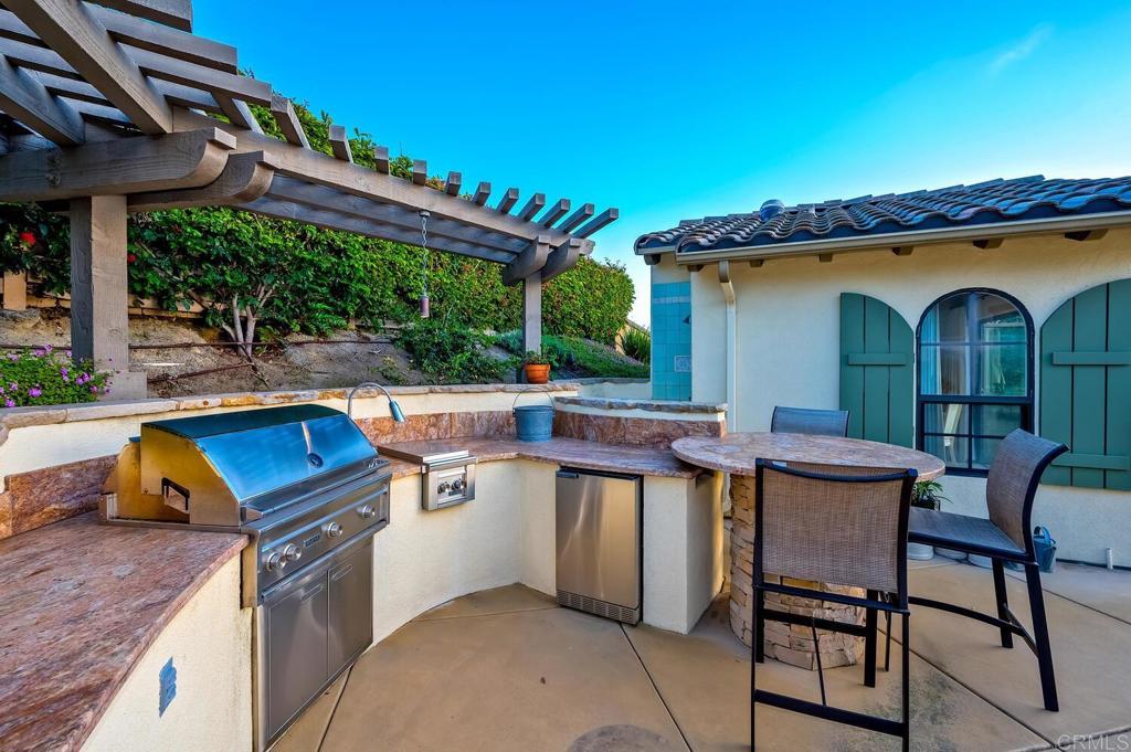7089 Heron Circle Carlsbad, CA 92011 - Photo 41 of 58 a view of a chairs and table in a patio