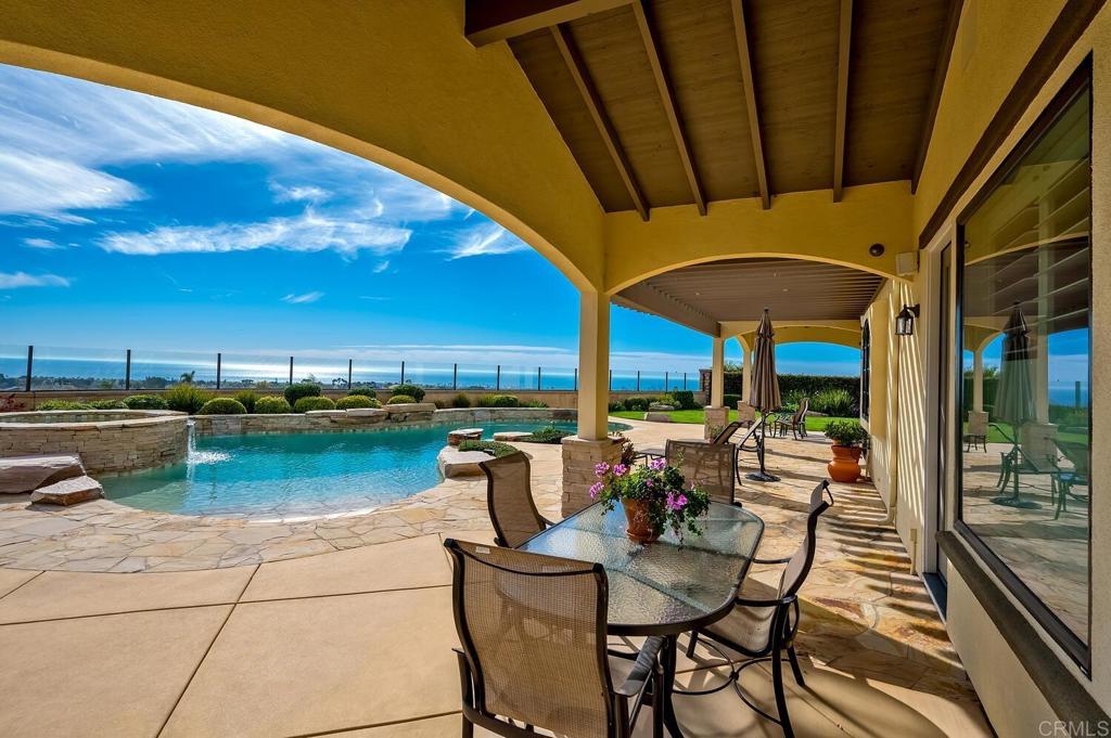 7089 Heron Circle Carlsbad, CA 92011 - Photo 44 of 58 a view of a swimming pool with outdoor seating