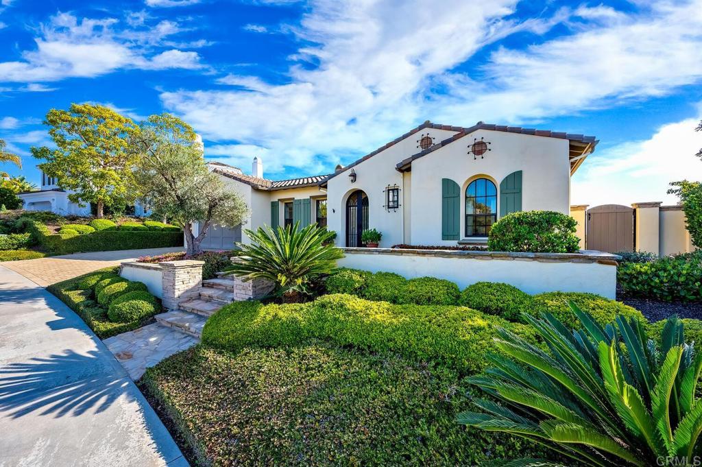 7089 Heron Circle Carlsbad, CA 92011 - Photo 5 of 58 a front view of a house with garden