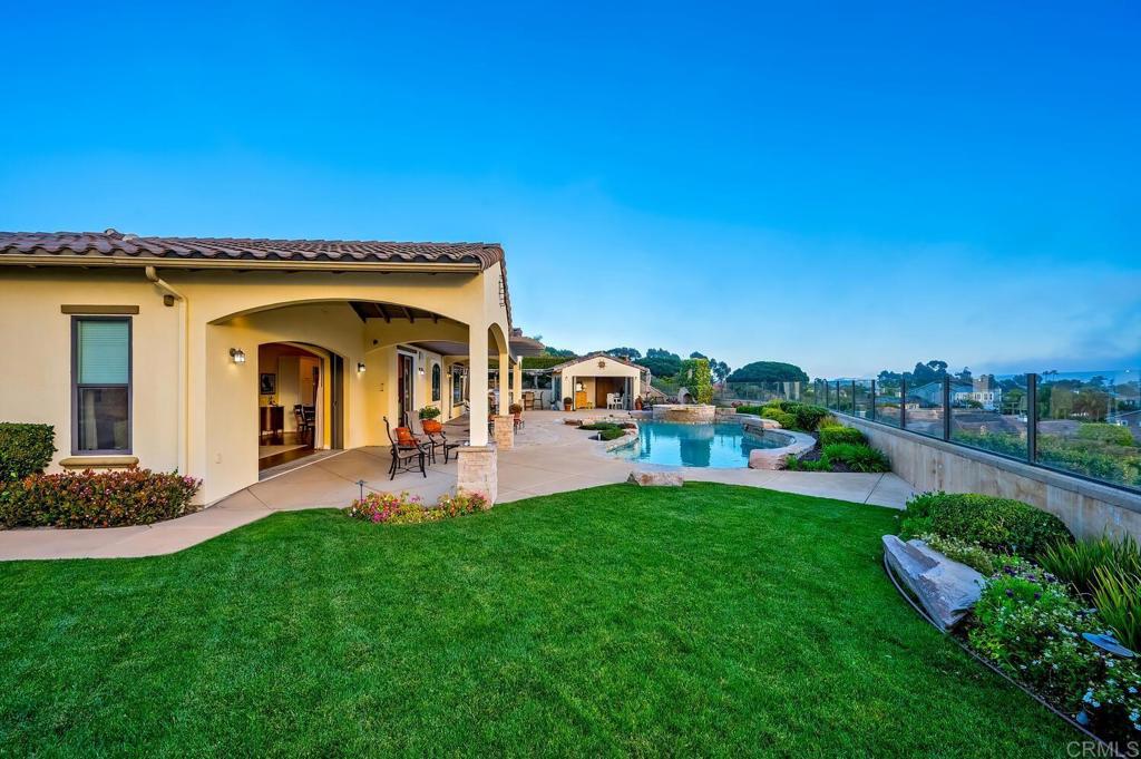 7089 Heron Circle Carlsbad, CA 92011 - Photo 55 of 58 a view of a house with a yard porch and sitting area