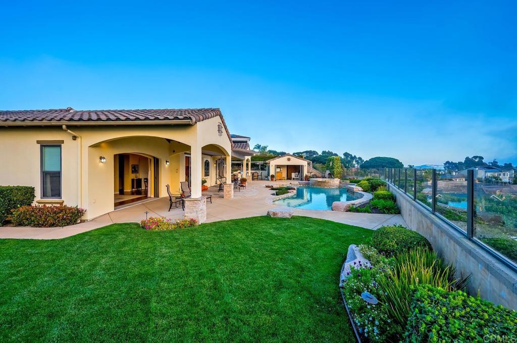 7089 Heron Circle Carlsbad, CA 92011 - Photo 57 of 58 a view of a house with a yard porch and sitting area