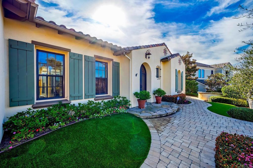 7089 Heron Circle Carlsbad, CA 92011 - Photo 6 of 58 a front view of house with yard and outdoor seating