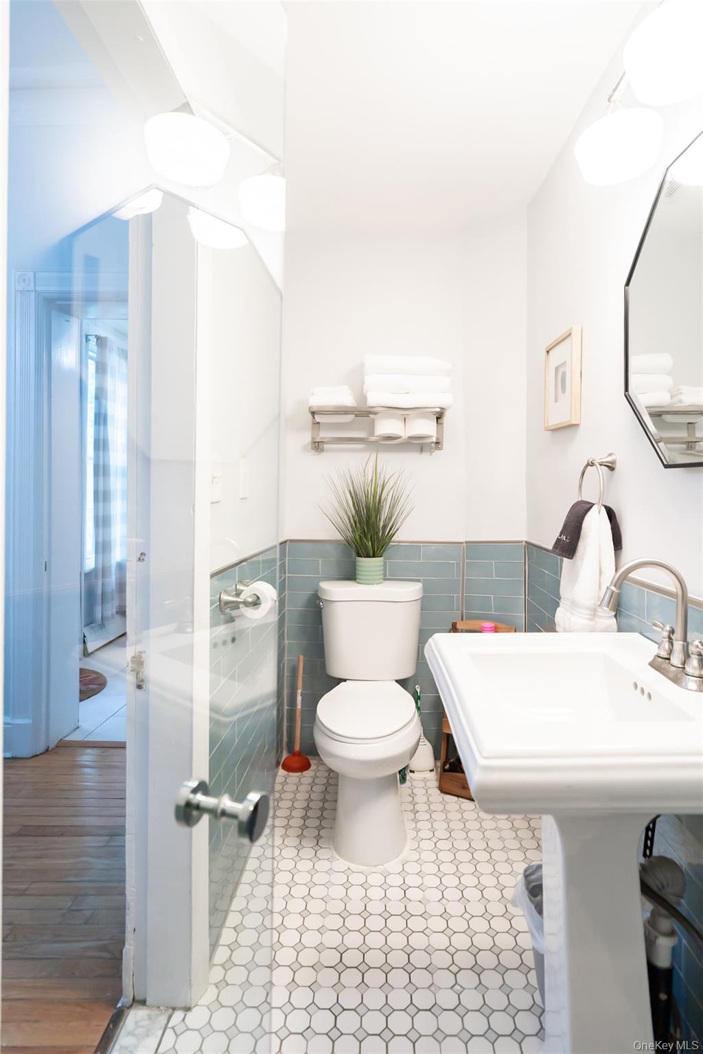 175 Liberty Street Newburgh, NY 12550 - Photo 13 of 50 a bathroom with a sink toilet and shower