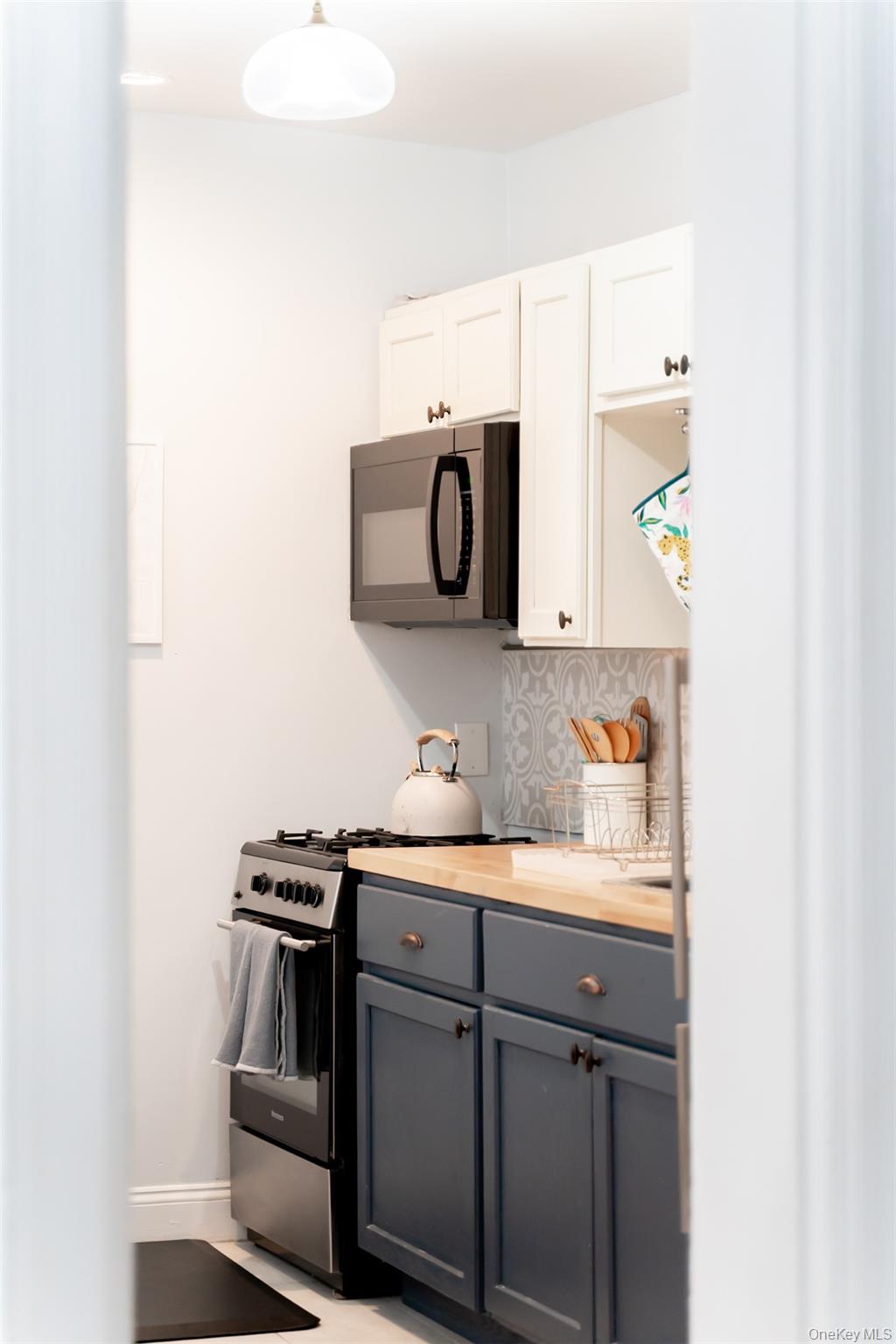 175 Liberty Street Newburgh, NY 12550 - Photo 15 of 50 a kitchen with a sink and a stove