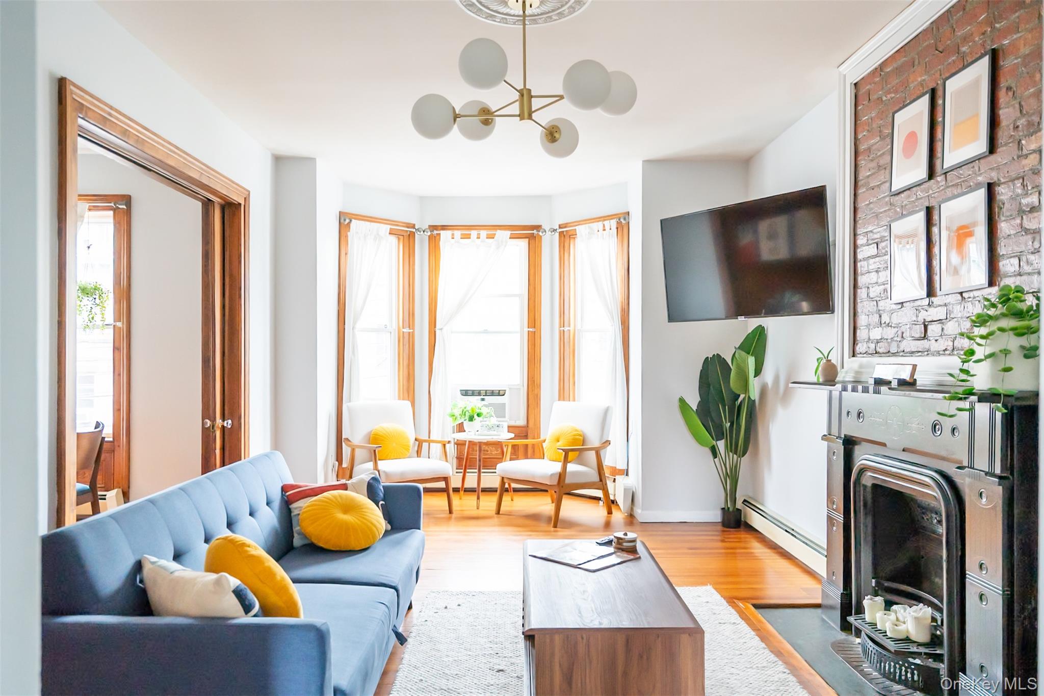 175 Liberty Street Newburgh, NY 12550 - Photo 2 of 50 a living room with furniture fireplace and flat screen tv