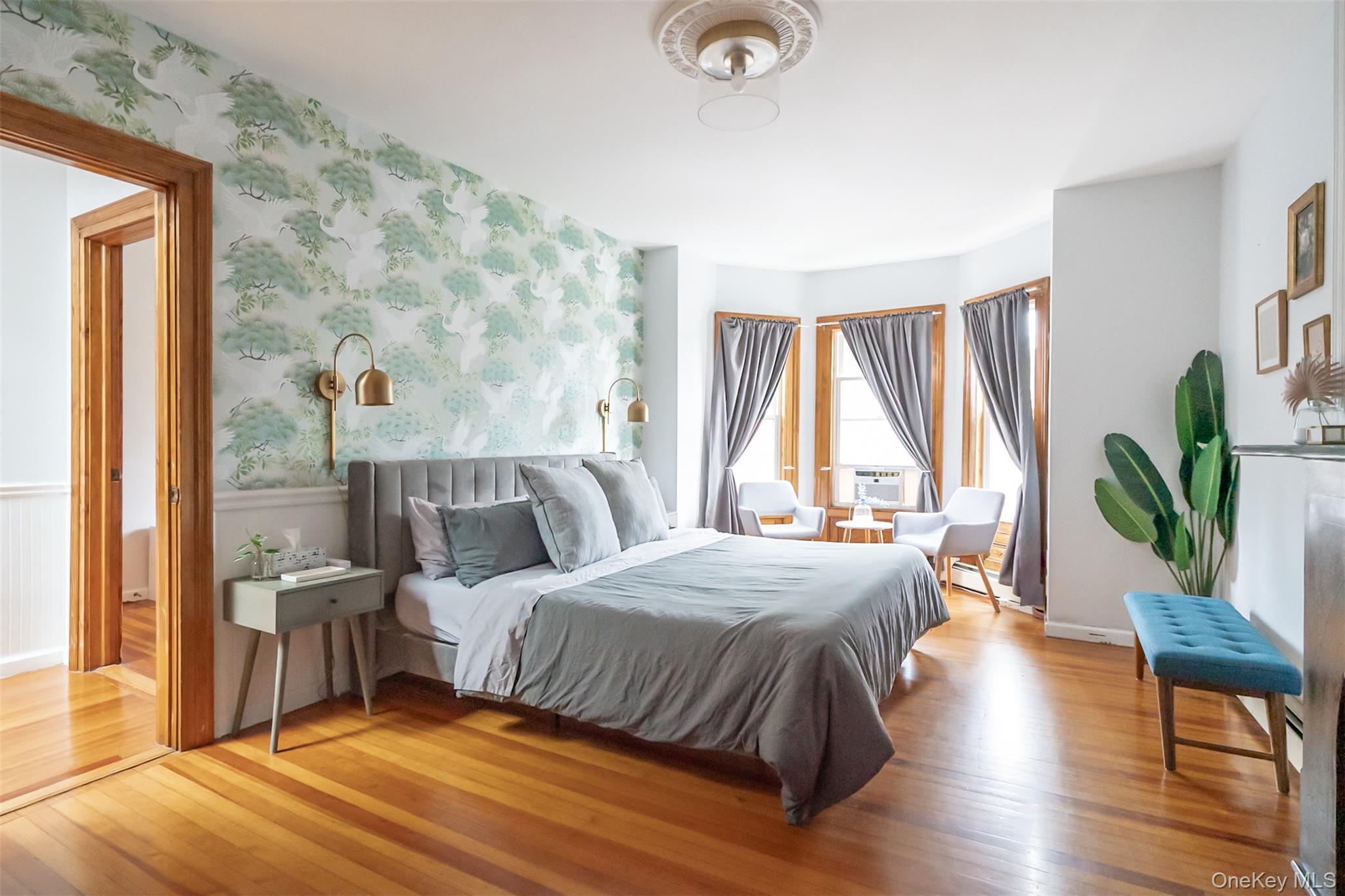 175 Liberty Street Newburgh, NY 12550 - Photo 24 of 50 a bedroom with a bed lamps and window