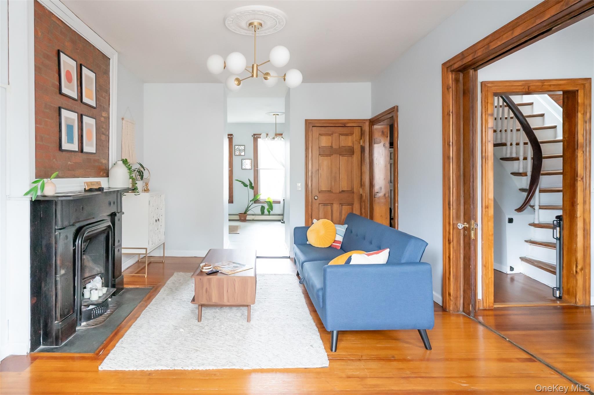 175 Liberty Street Newburgh, NY 12550 - Photo 3 of 50 a living room with furniture and a fireplace