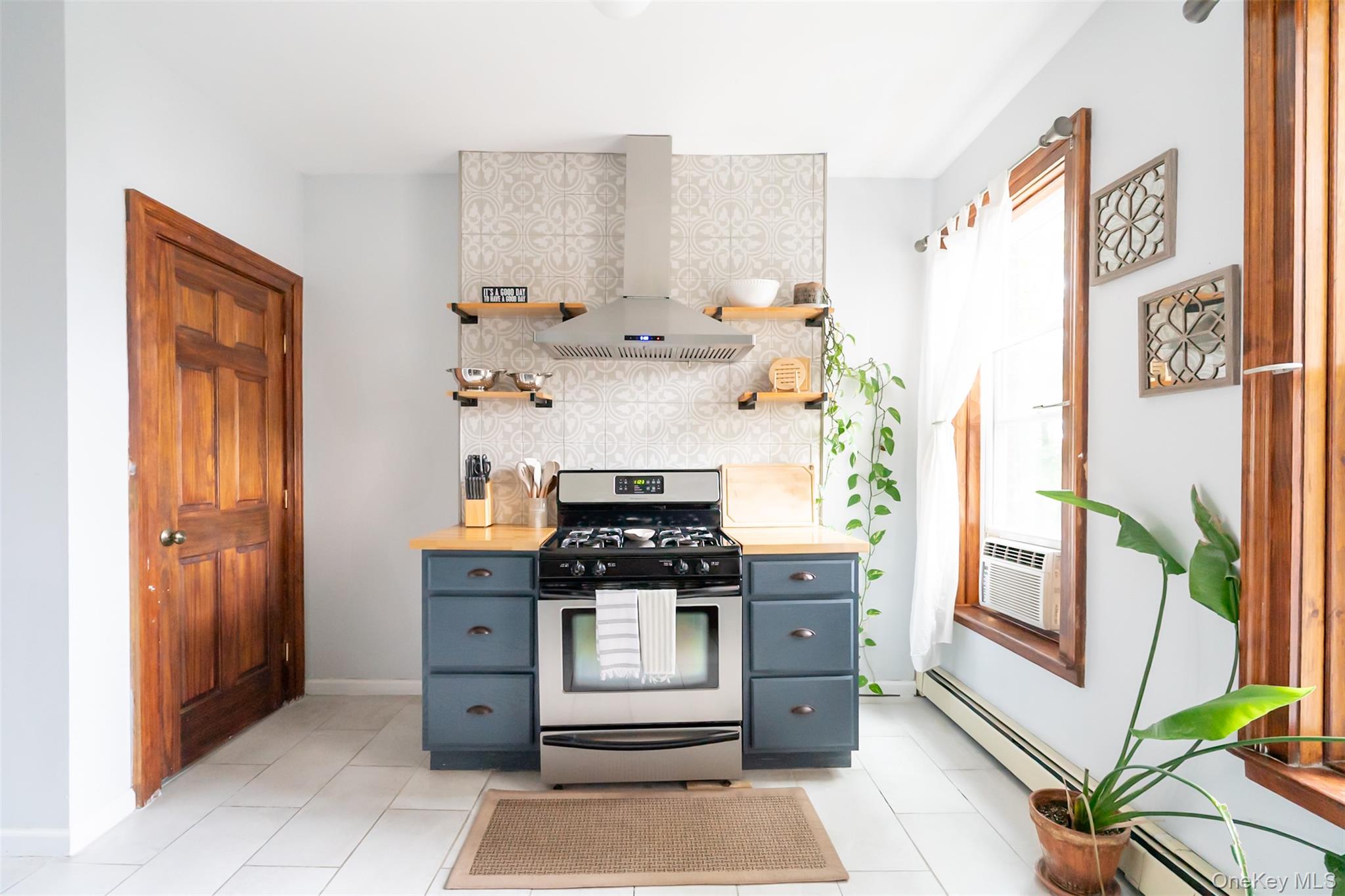 175 Liberty Street Newburgh, NY 12550 - Photo 35 of 50 a kitchen with stainless steel appliances a stove and a refrigerator