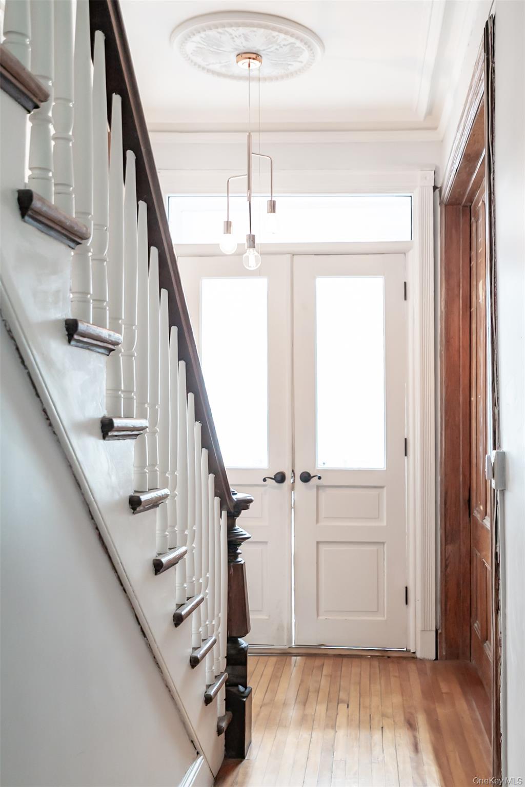 175 Liberty Street Newburgh, NY 12550 - Photo 4 of 50 a view of entryway with wooden floor and stairs