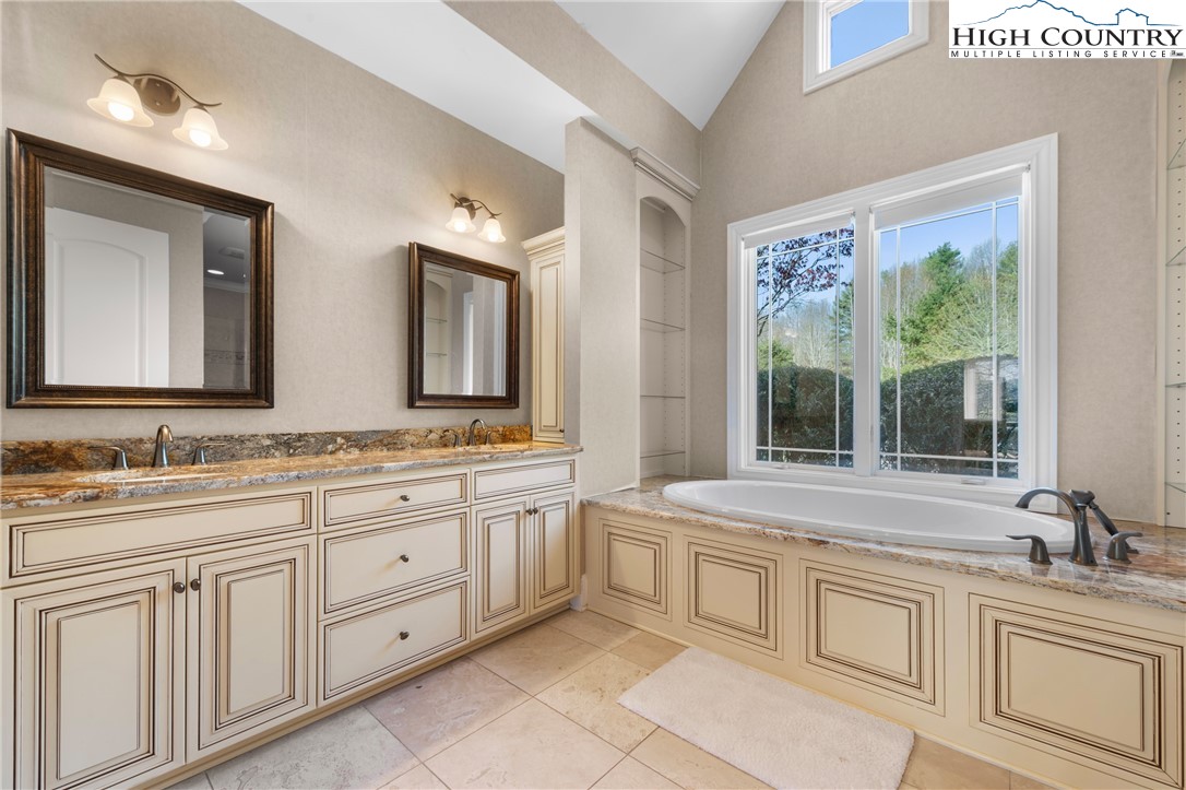 46 North Ridge Lane Newland, NC 28657 - Photo 18 of 46 a bathroom with a sink and a large mirror