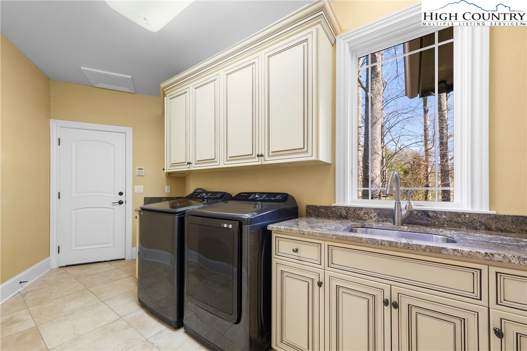 46 North Ridge Lane Newland, NC 28657 - Photo 25 of 46 a kitchen with stainless steel appliances granite countertop a sink stove and cabinets