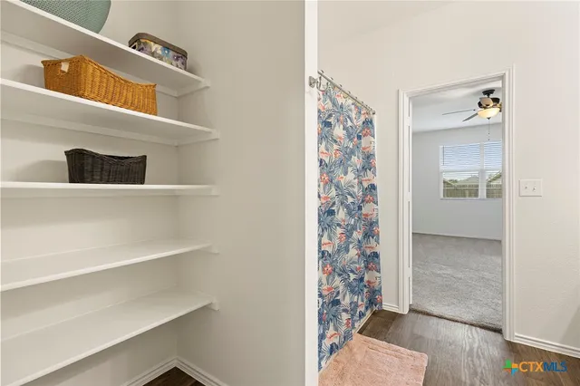 a view of an entryway with wooden floor