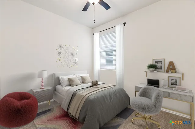 a bedroom with a bed and ceiling fan