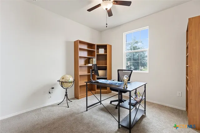 a view of a workspace with furniture