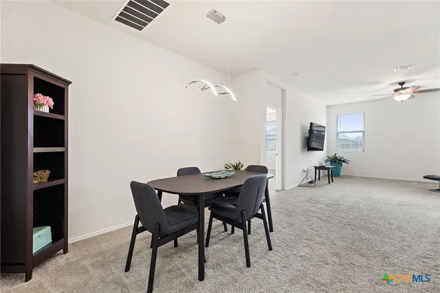 a view of a workspace with furniture