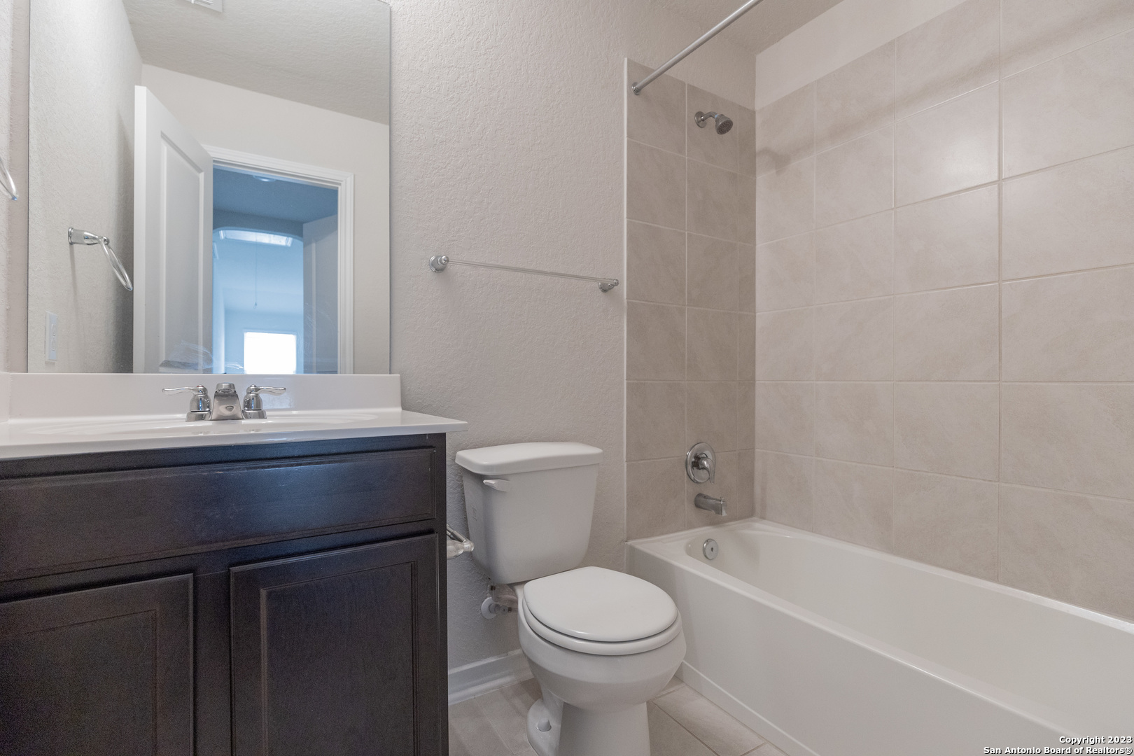 9819 Bratten Rise San Antonio, TX 78254 - Photo 26 of 37 a bathroom with a sink toilet and shower