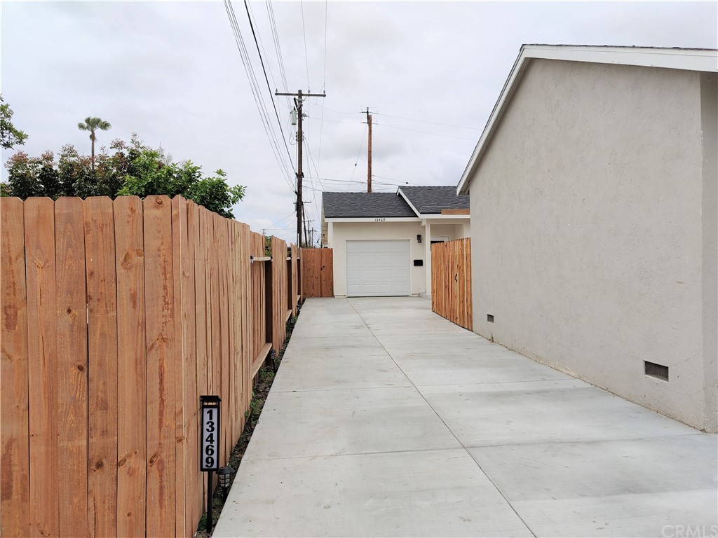 a view of a roof deck with wooden fence