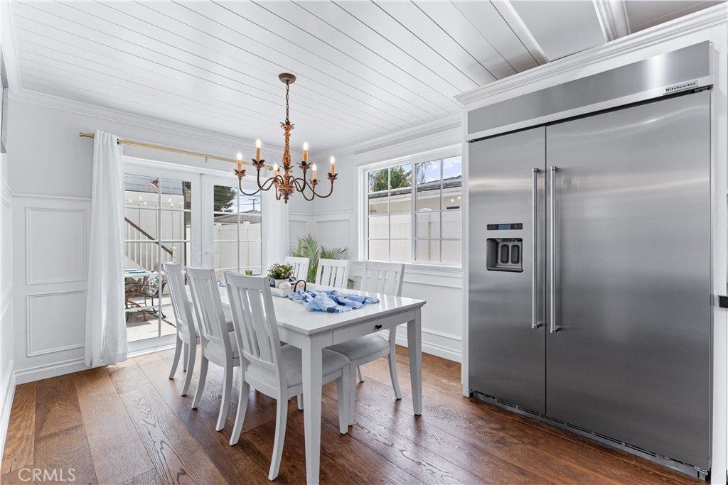 208 Indianapolis Avenue Huntington Beach, CA 92648 - Photo 18 of 66 a view of a dining room with furniture window and wooden floor
