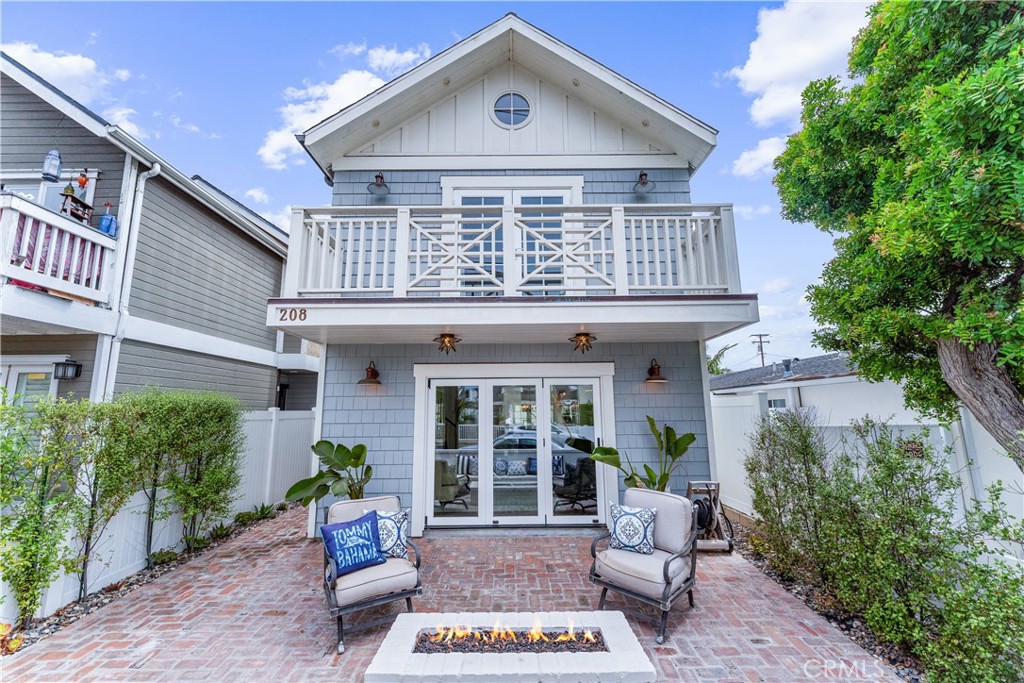 208 Indianapolis Avenue Huntington Beach, CA 92648 - Photo 2 of 66 a front view of a house with a yard