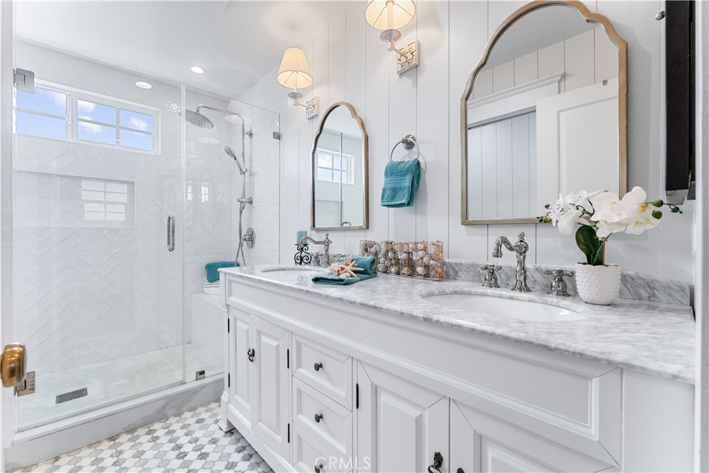 208 Indianapolis Avenue Huntington Beach, CA 92648 - Photo 26 of 66 a bathroom with a sink a vanity and a mirror