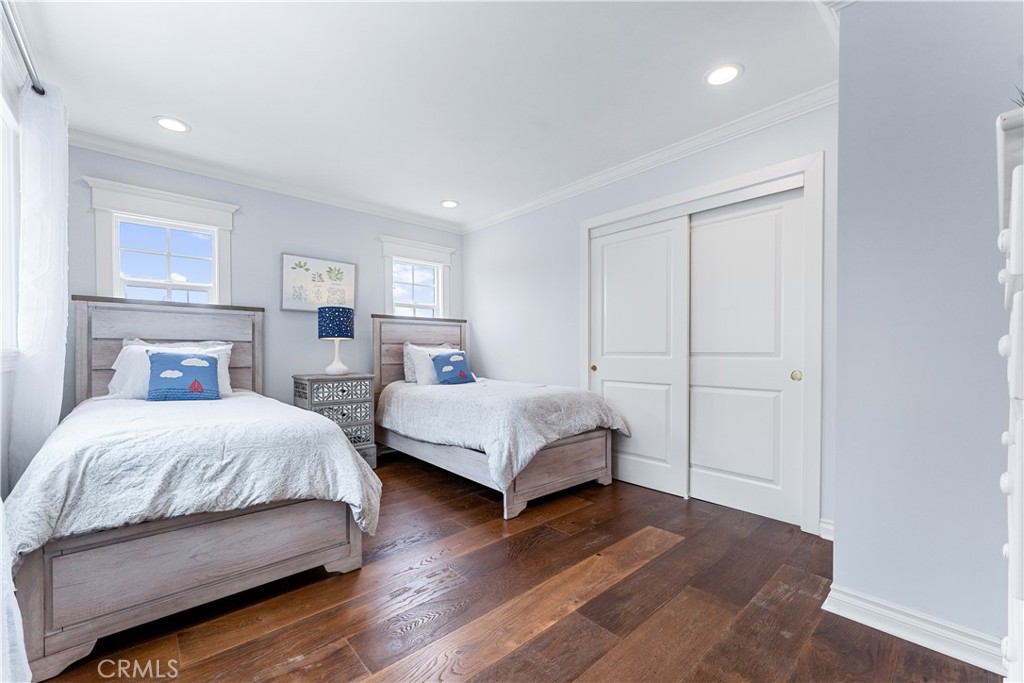 208 Indianapolis Avenue Huntington Beach, CA 92648 - Photo 30 of 66 a bedroom with a bed and a night stand