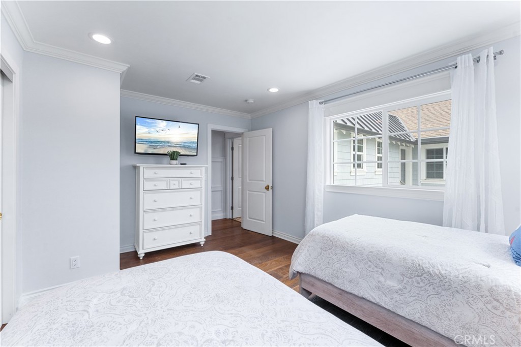 208 Indianapolis Avenue Huntington Beach, CA 92648 - Photo 31 of 66 a bedroom with a bed and a tv