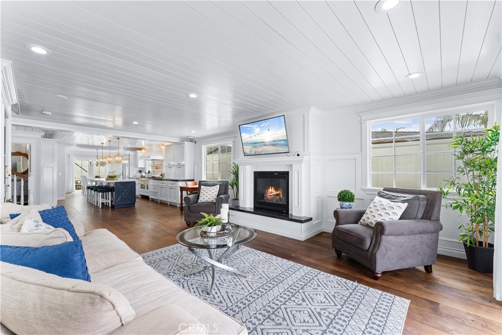 208 Indianapolis Avenue Huntington Beach, CA 92648 - Photo 9 of 66 a living room with furniture and a fireplace