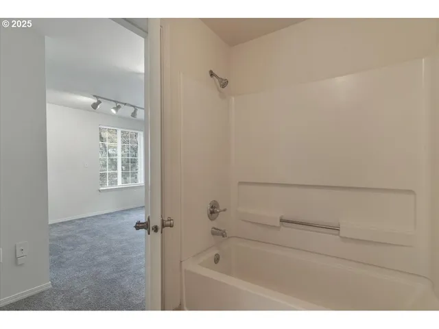 a view of an empty room with a window