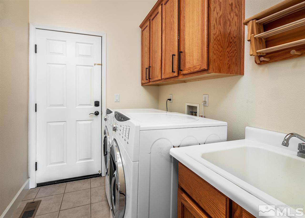 620 Rabbit Ridge Court Reno, NV 89511 - Photo 26 of 34 a utility room with dryer and washer
