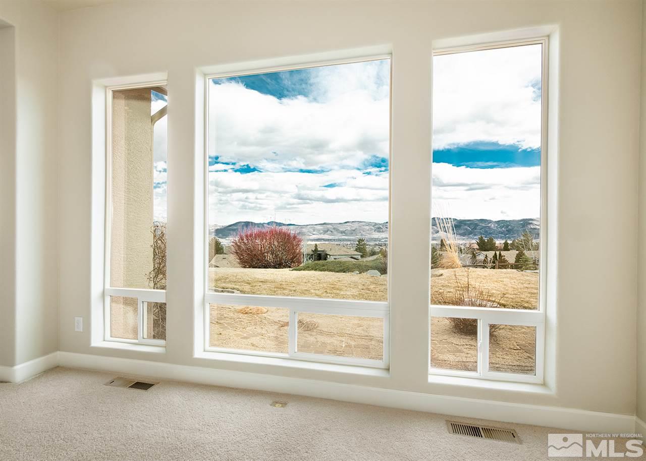 620 Rabbit Ridge Court Reno, NV 89511 - Photo 6 of 34 a view of an empty room with a window