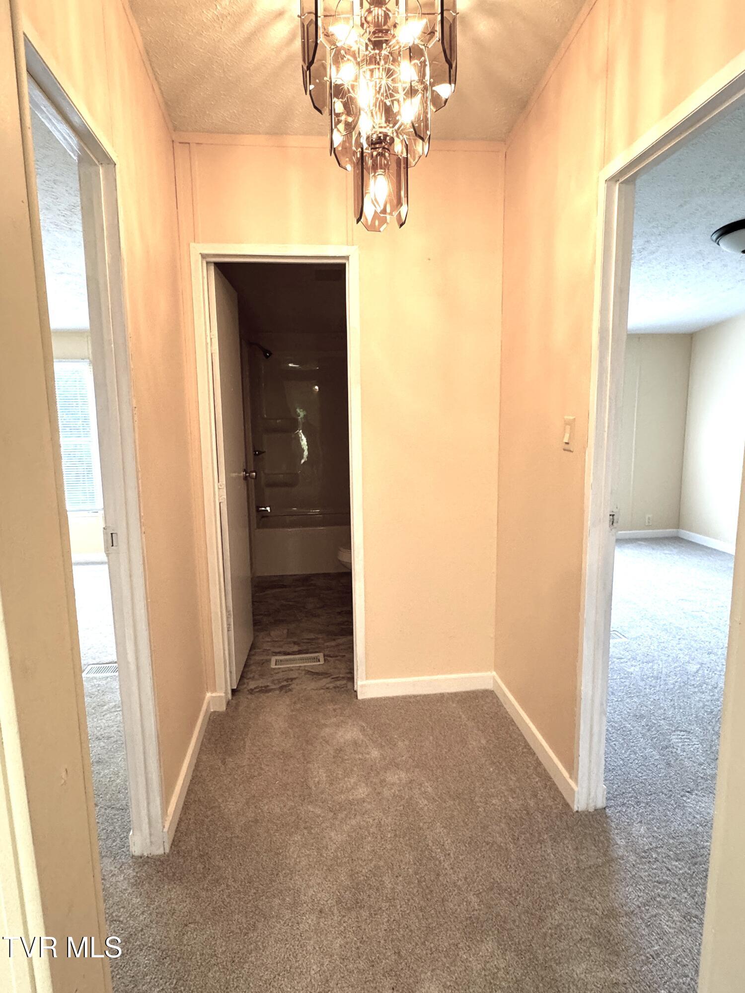 1555 Hamner Hollow Road Big Stone Gap, VA 24219 - Photo 26 of 41 HALLWAY BETWEEN EXTRA BEDROOMS