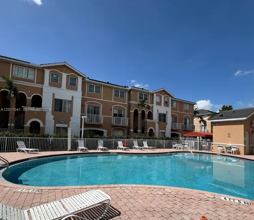 a view of pool with outdoor seating