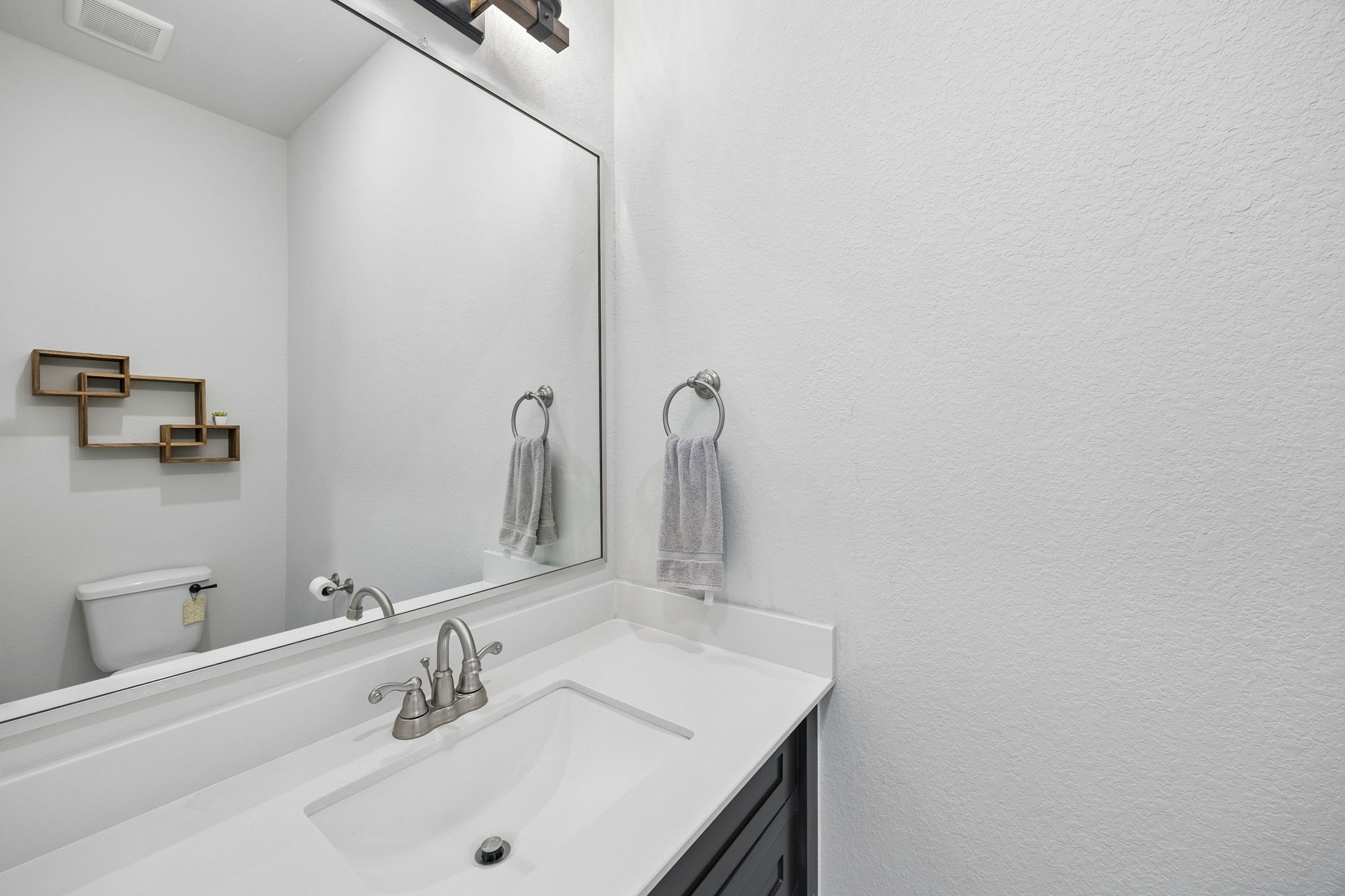 10102 South Goshawk Trail Conroe, TX 77385 - Photo 32 of 46 a bathroom with a sink and a mirror