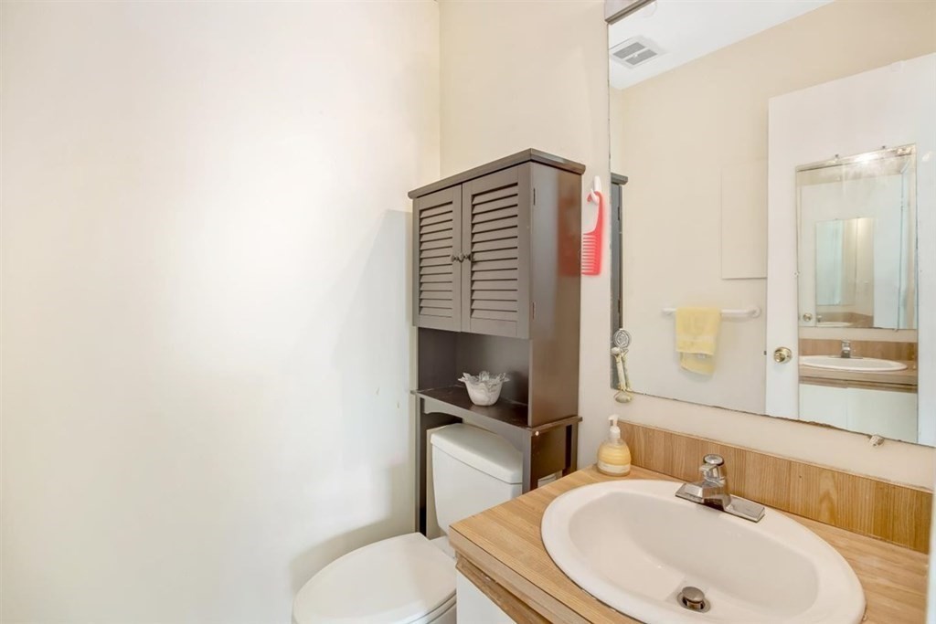 28 Symphony Road, Unit 3 Boston, MA 02115 - Photo 12 of 13 a bathroom with a sink a toilet and shower curtain