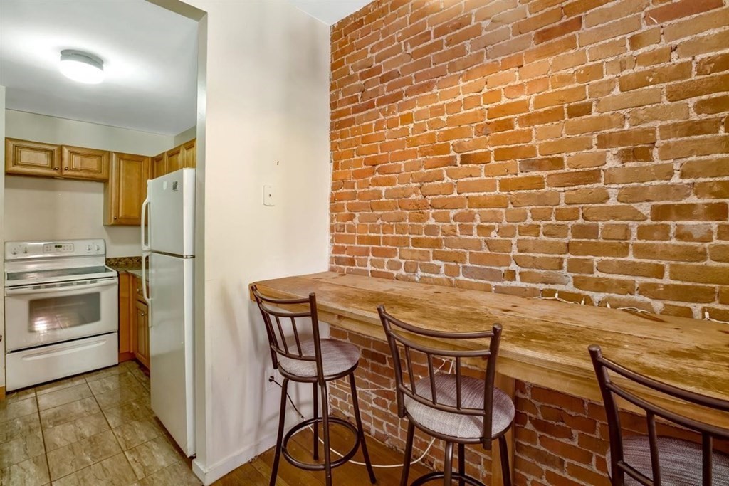 28 Symphony Road, Unit 3 Boston, MA 02115 - Photo 3 of 13 a kitchen with a cabinets and appliances