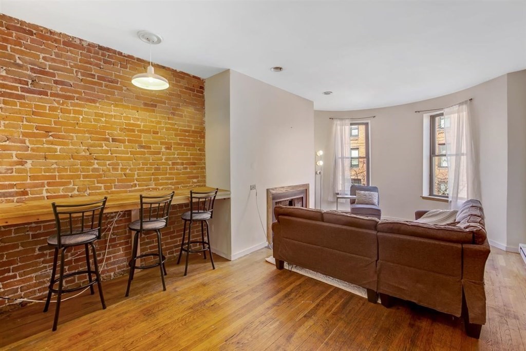 28 Symphony Road, Unit 3 Boston, MA 02115 - Photo 5 of 13 a room with furniture wooden floor and windows