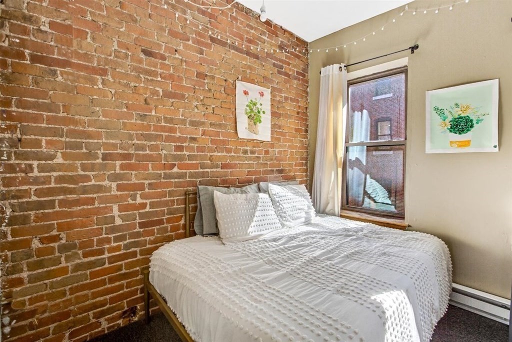 28 Symphony Road, Unit 3 Boston, MA 02115 - Photo 9 of 13 a bedroom with a bed and a painting on the wall