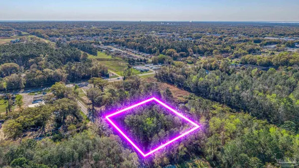 an aerial view of a house with a outdoor space