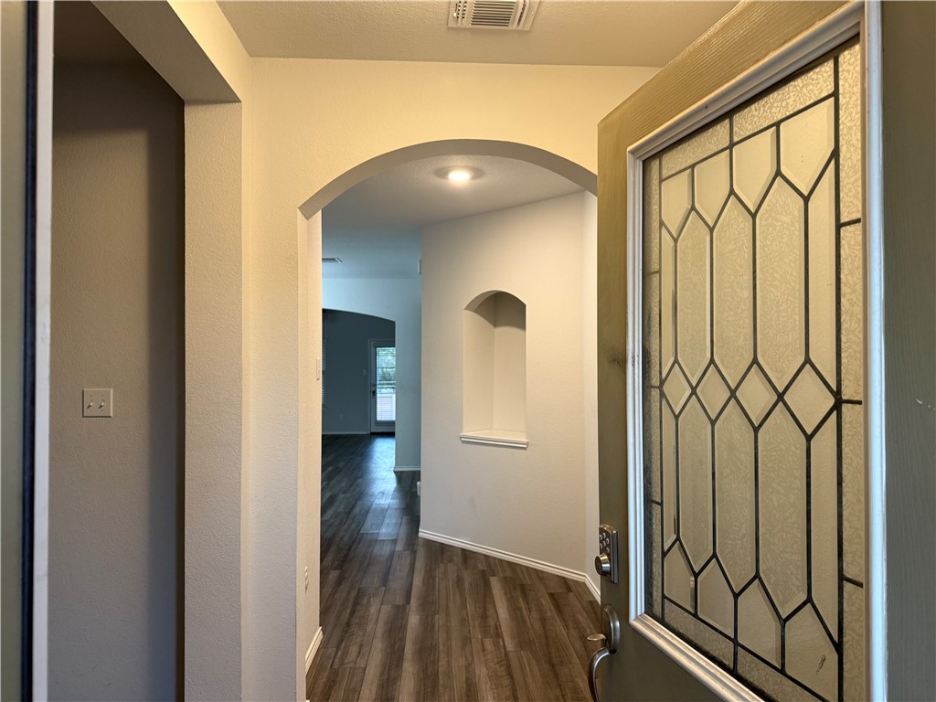 a view of entryway with wooden floor