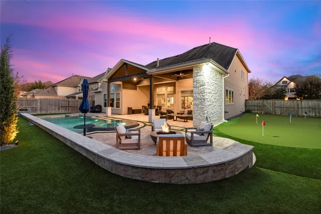 a view of a house with a yard from a patio