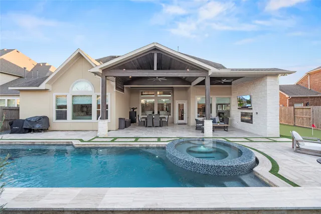 a view of a house with swimming pool and porch