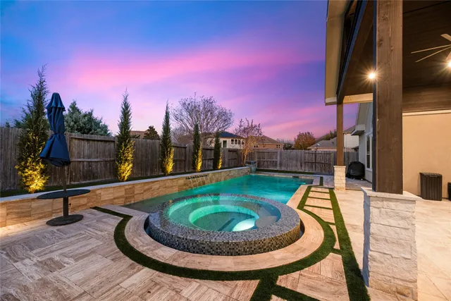 a view of a swimming pool with a patio