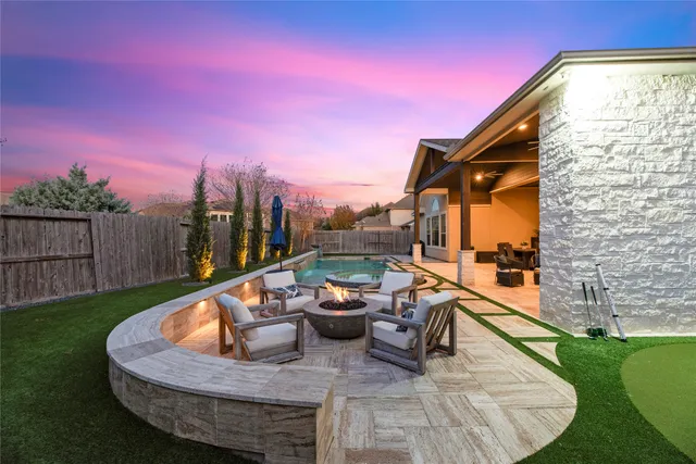 a view of a swimming pool with a patio