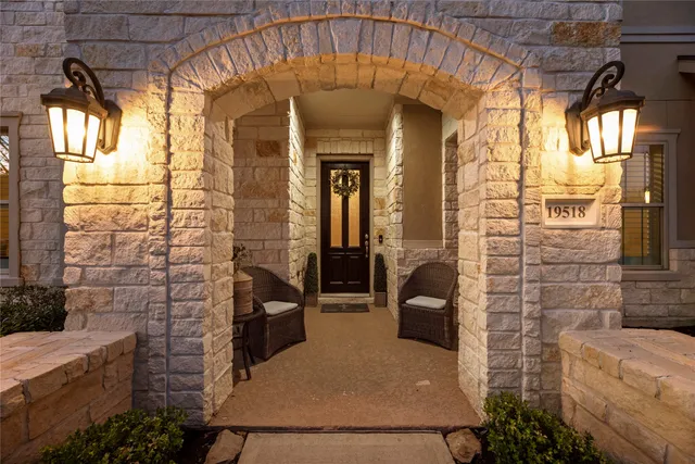 a view of a brick house with many windows