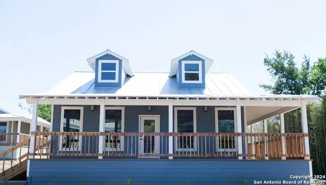 a front view of a house with a porch