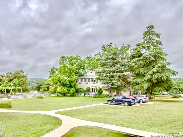 a view of a swimming pool with a yard