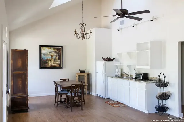 a dining room with furniture and window