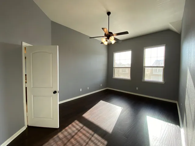 a view of an empty room with a window