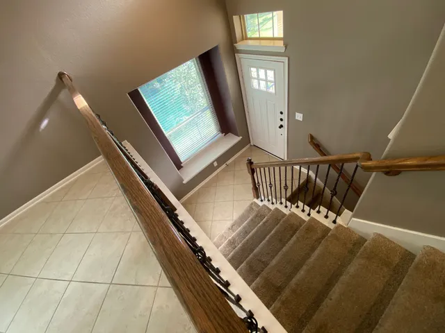 a view of a bathroom from a corridor